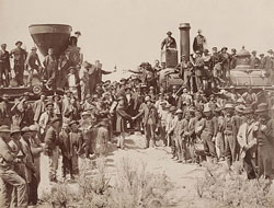 450px-East_and_West_Shaking_hands_at_the_laying_of_last_rail_Union_Pacific_Railroad_-_Restoration